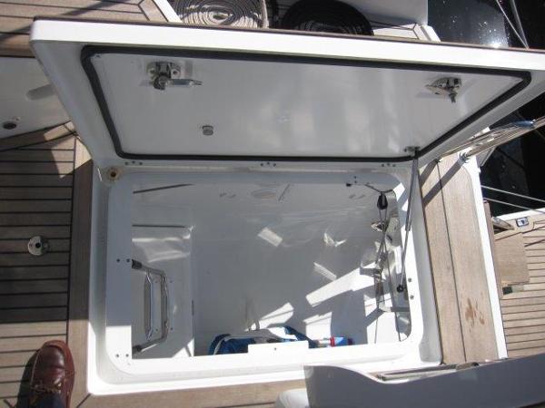 Slide: The Image of Open storage compartment on 2025 Jeanneau Yacht 65 deck. - 43