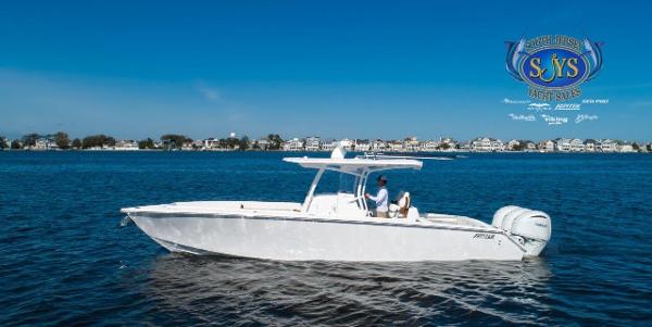 Slide: The Image of 2024 Jupiter 34 boat cruising on a calm blue lake. - 0
