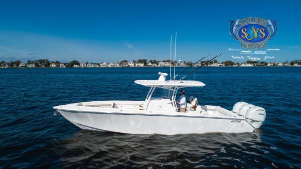 Slide: The Image of 2024 Jupiter 34 boat cruising on a calm blue lake. - 1