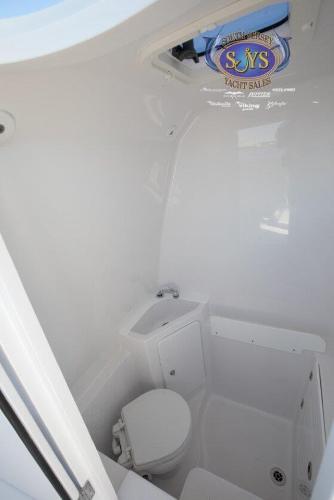 Slide: The Image of 2024 Jupiter 34 boat interior bathroom with toilet and sink - 11