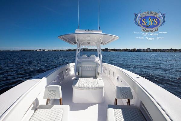 Slide: The Image of 2024 Jupiter 34 yacht on open water, South Jersey Yacht Sales logo. - 15