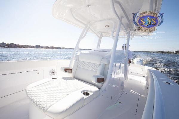 Slide: The Image of 2024 Jupiter 34 yacht interior with luxurious seating on open water. - 16