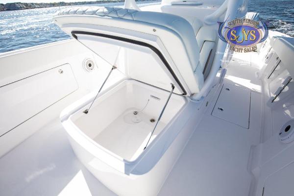 Slide: The Image of 2024 Jupiter 34 boat with open storage compartment on deck. - 17