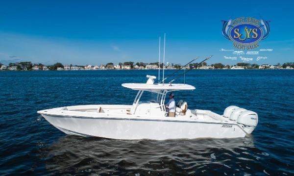Slide: The Image of 2024 Jupiter 34 boat cruising on a lake, South Jersey Yacht Sales logo. - 2