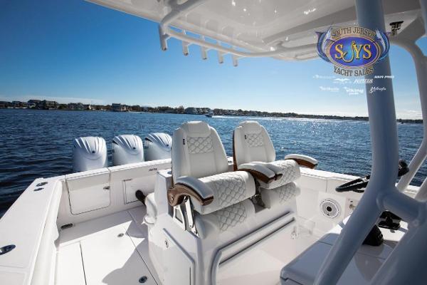 Slide: The Image of 2024 Jupiter 34 boat interior with luxurious seating and ocean view. - 20