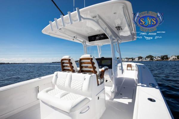 Slide: The Image of 2024 Jupiter 34 boat with luxurious seating on open water. - 22