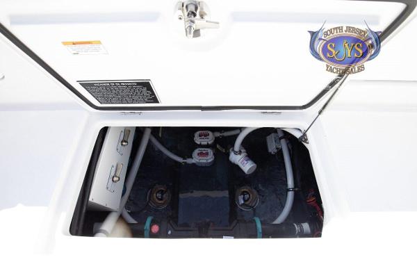 Slide: The Image of 2024 Jupiter 34 boat engine compartment with South Jersey Yacht Sales logo. - 30