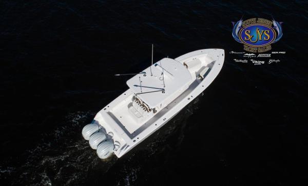 Slide: The Image of 2024 Jupiter 34 boat cruising on dark waters, aerial view. - 33