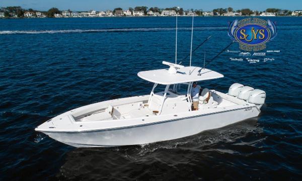 Slide: The Image of 2024 Jupiter 34 boat cruising on a calm blue lake. - 5