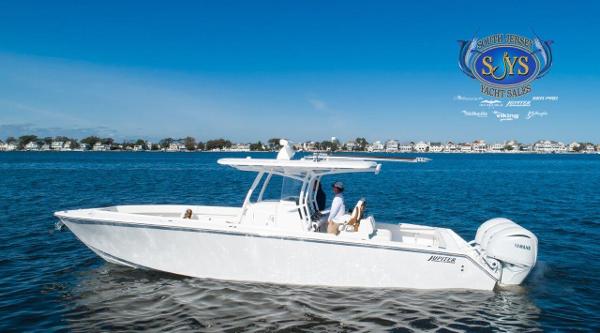 Slide: The Image of 2024 Jupiter 34 boat cruising on a calm blue lake. - 9