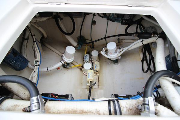 Slide: The Image of 2008 Jupiter 34 FS boat engine compartment with wiring and plumbing. - 11