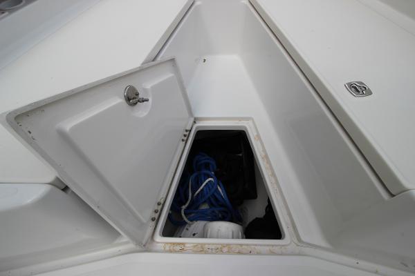 Slide: The Image of Open storage compartment on a 2008 Jupiter 34 FS boat with ropes inside. - 9