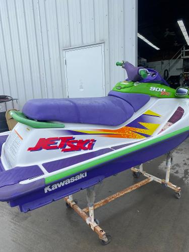 Slide: The Image of 1996 Kawasaki ZXI 900 Jet Ski with purple and green accents. - 2