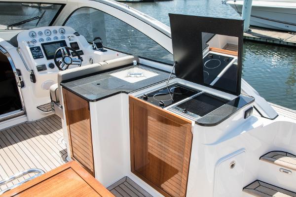 Slide: The Image of 2025 Keizer 42 yacht interior with modern kitchen and control panel. - 11