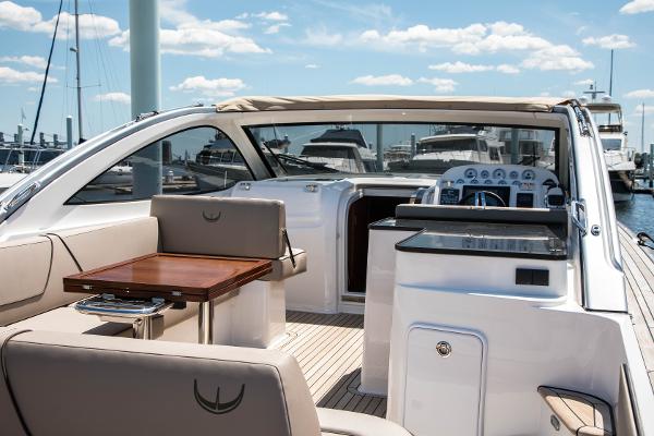 Slide: The Image of 2025 Keizer 42 yacht interior with seating and control panel at marina. - 6