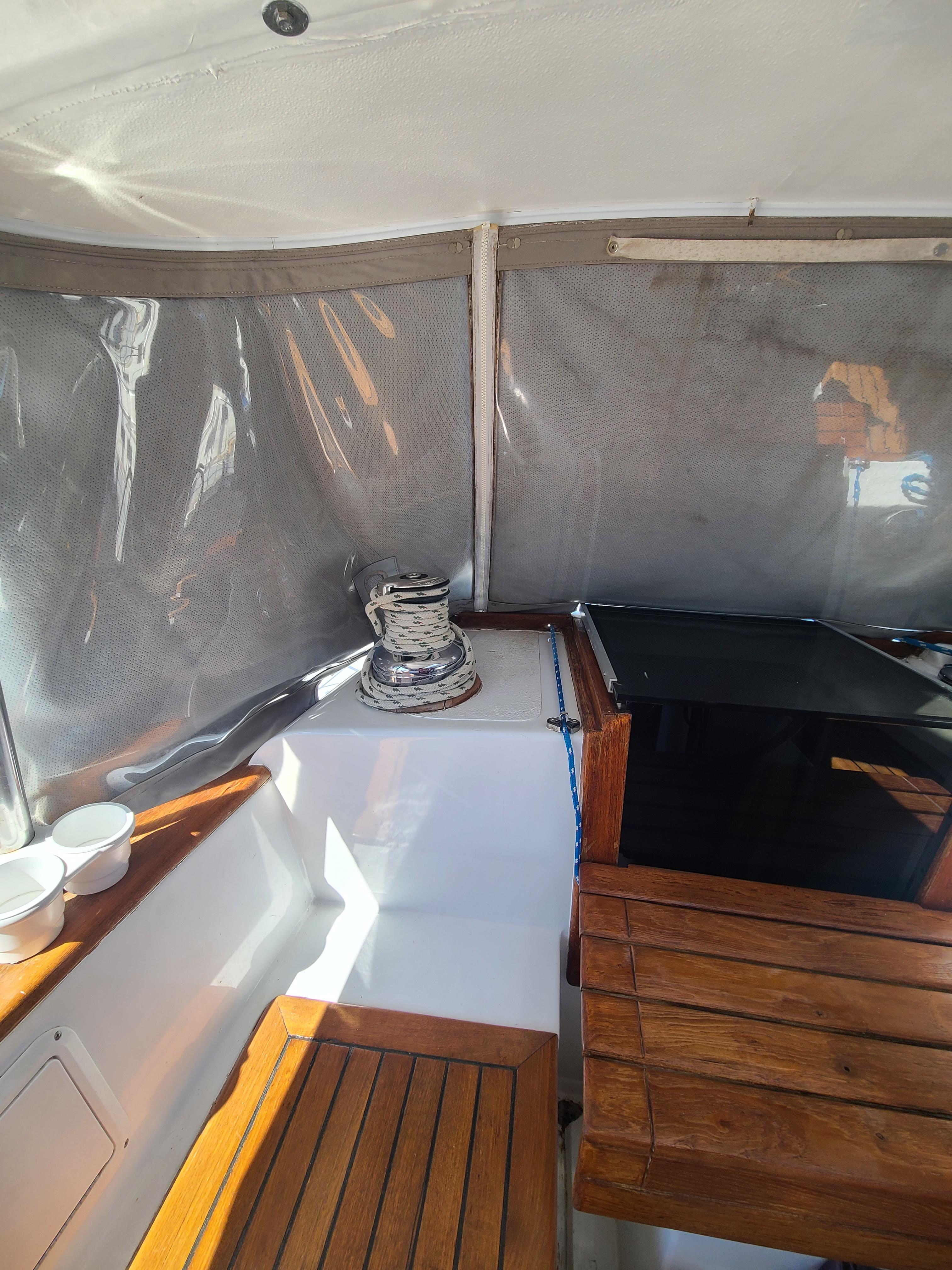 Slide: The Image of Interior of 1981 Kelly Peterson 44 sailboat with wooden seating and winch. - 36