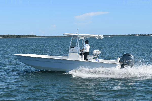 Slide: The Image of 2025 KenCraft 2460 Bay Rider Skiff cruising on open water. - 0