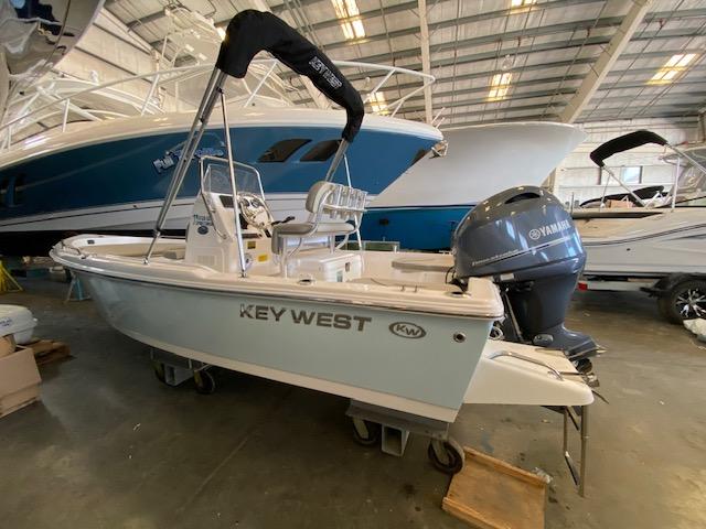 Slide: The Image of 2023 Key West 1720CC boat in a showroom with Yamaha outboard motor. - 0