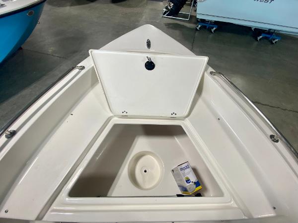 Slide: The Image of 2024 Key West 1720 CC boat with open storage compartment. - 16