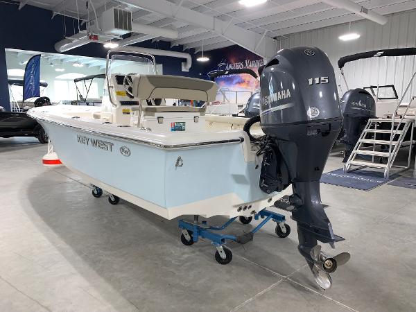 Slide: The Image of 2024 Key West 188 Bay Reef boat with Yamaha 115 engine in showroom. - 1