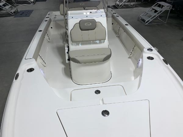 Slide: The Image of 2024 Key West 188 Bay Reef boat interior with seating and storage compartments. - 12