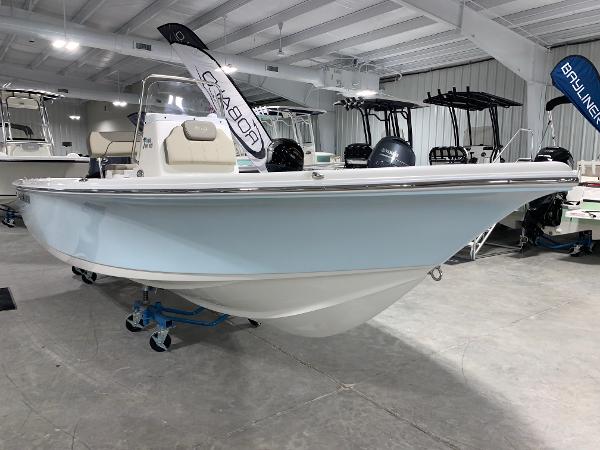 Slide: The Image of 2024 Key West 188 Bay Reef boat in showroom, light blue hull, center console. - 2