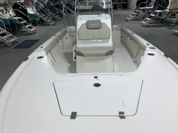 Slide: The Image of 2024 Key West 188 Bay Reef boat interior with seating and storage compartments. - 4