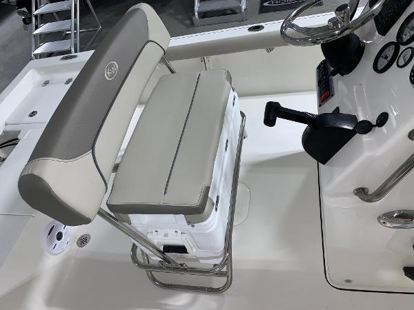 Slide: The Image of 2024 Key West 188 Bay Reef boat interior with cushioned seating and control console. - 6
