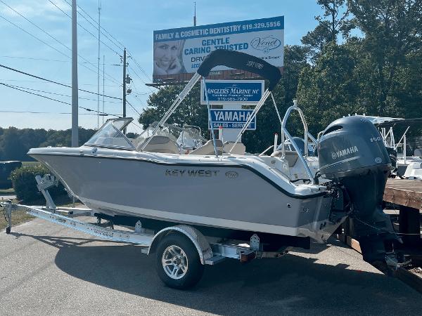 Slide: The Image of 2024 Key West 203 DFS boat on trailer with Yamaha outboard motor. - 0