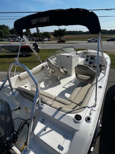 Slide: The Image of 2024 Key West 203 DFS boat with seating and canopy on display. - 3