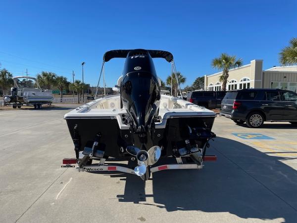 Slide: The Image of 2023 Key West 210 Bay Reef boat, rear view, on trailer in parking lot. - 1