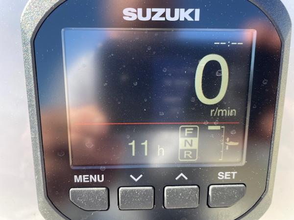Slide: The Image of Suzuki digital display on 2023 Key West 210 Bay Reef boat showing 11 hours. - 10