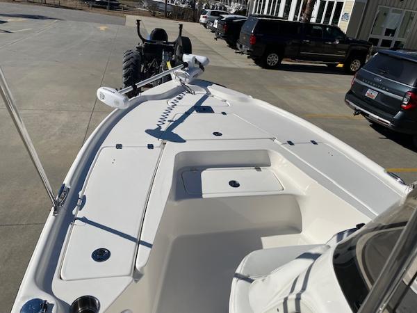 Slide: The Image of 2023 Key West 210 Bay Reef boat on a trailer in a parking lot. - 11