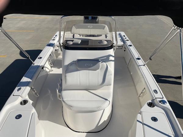 Slide: The Image of 2023 Key West 210 Bay Reef boat interior with center console and seating. - 12