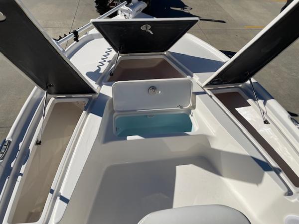 Slide: The Image of 2023 Key West 210 Bay Reef boat with open storage compartments. - 14