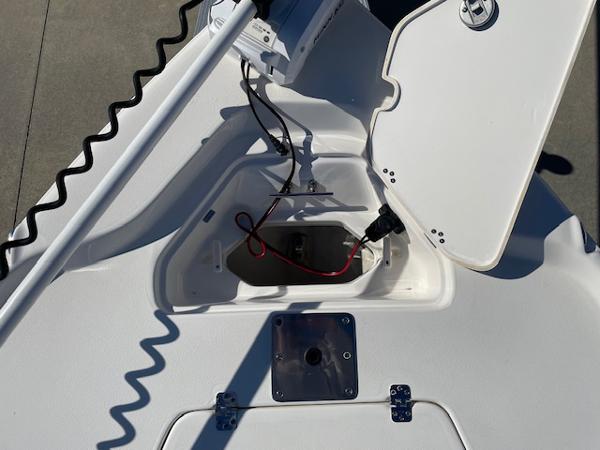 Slide: The Image of 2023 Key West 210 Bay Reef boat with open storage compartment and wiring. - 15
