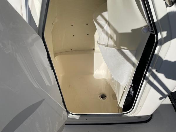 Slide: The Image of 2023 Key West 210 Bay Reef boat storage compartment. - 16