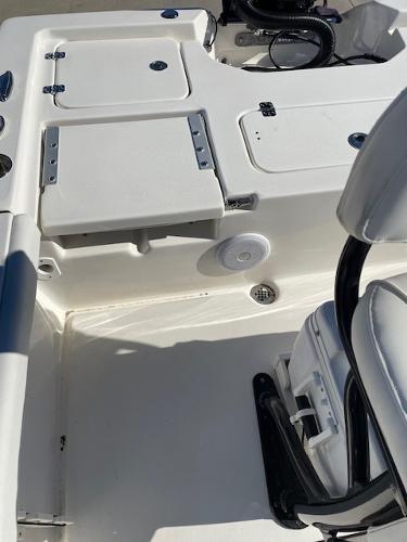 Slide: The Image of 2023 Key West 210 Bay Reef boat interior with seating and storage compartments. - 5