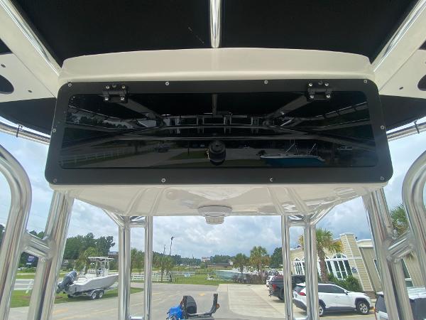 Slide: The Image of 2024 Key West 210 Bay Reef boat console with overhead storage. - 12