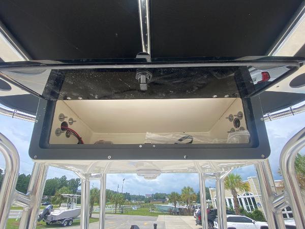 Slide: The Image of 2024 Key West 210 Bay Reef boat console storage compartment. - 13
