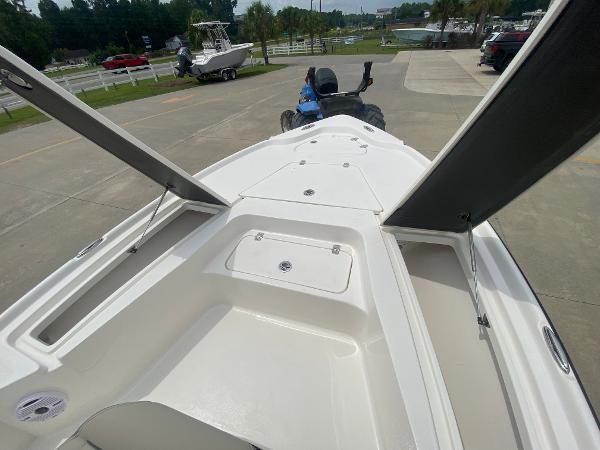Slide: The Image of 2024 Key West 210 Bay Reef boat interior with open storage compartments. - 18