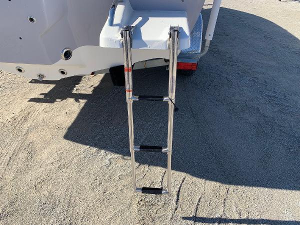 Slide: The Image of 2024 Key West 210 Bay Reef boat with extended swim ladder. - 18