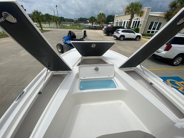 Slide: The Image of 2024 Key West 210 Bay Reef boat with open storage compartments and livewell. - 20
