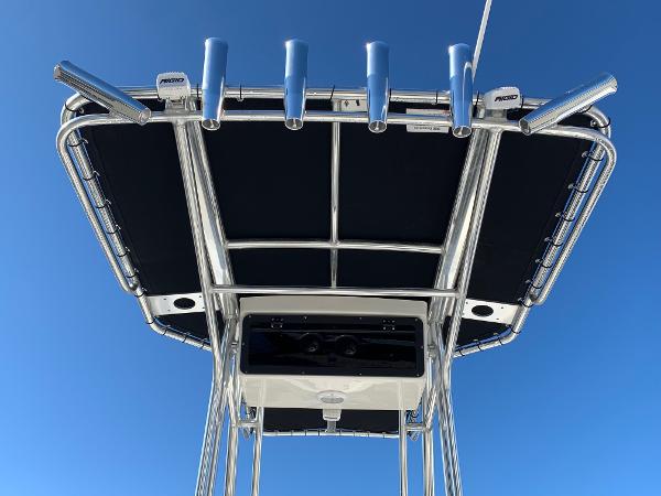 Slide: The Image of T-top of 2024 Key West 210 Bay Reef boat against clear blue sky. - 3
