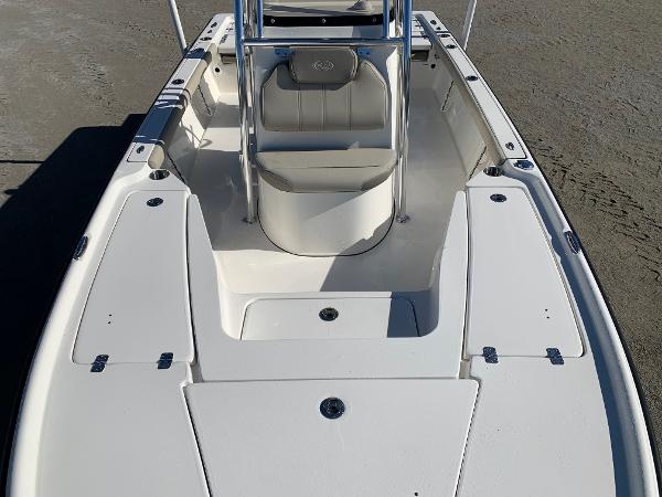 Slide: The Image of 2024 Key West 210 Bay Reef boat interior, front seating and storage compartments. - 6