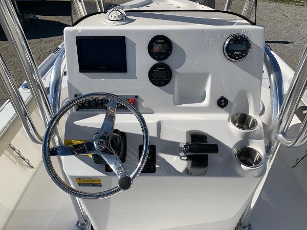 Slide: The Image of 2024 Key West 210 Bay Reef boat console with steering wheel and gauges. - 7