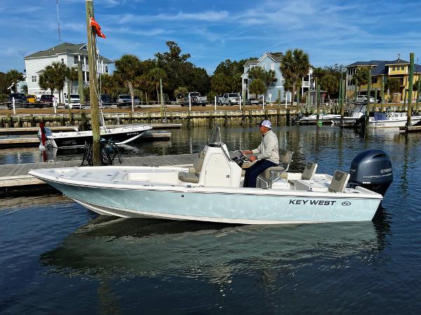 Slide: The Image of 2025 Key West 210 Bay Reef boat in marina, calm waters, clear sky. - 0