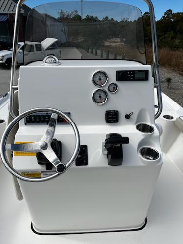 Slide: The Image of 2025 Key West 210 Bay Reef boat console with steering wheel and gauges. - 16