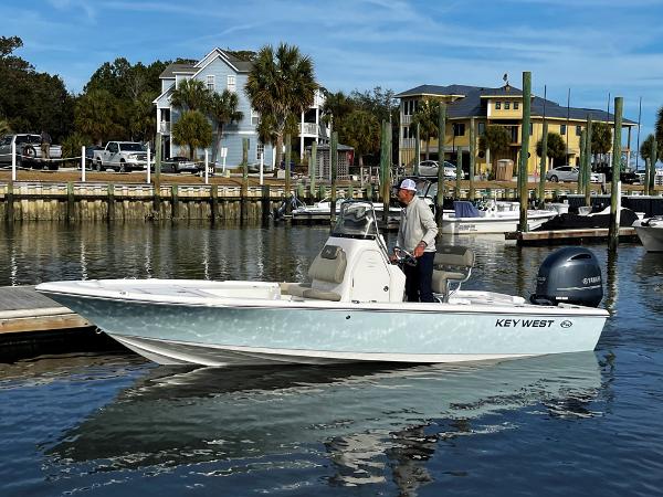 Slide: The Image of 2025 Key West 210 Bay Reef boat docked in a scenic marina. - 27
