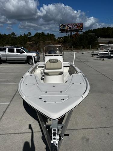 Slide: The Image of 2025 Key West 210 Bay Reef boat in parking lot under cloudy sky. - 6